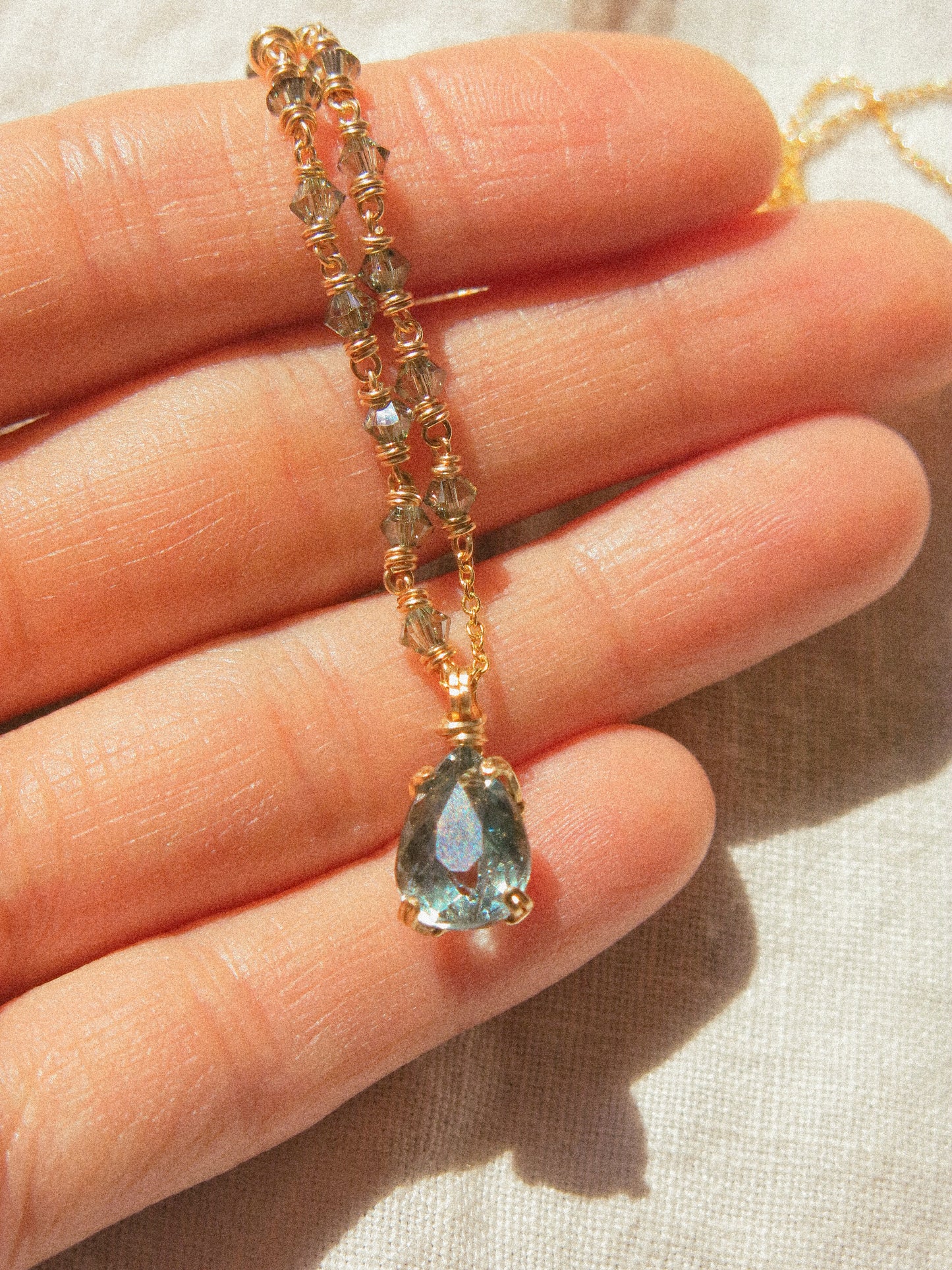 Blue: Prong Set Teardrop Faceted Icy Blue Tourmaline Necklace with Swarovski Crystal Accent Chain, 14K Gold Fill