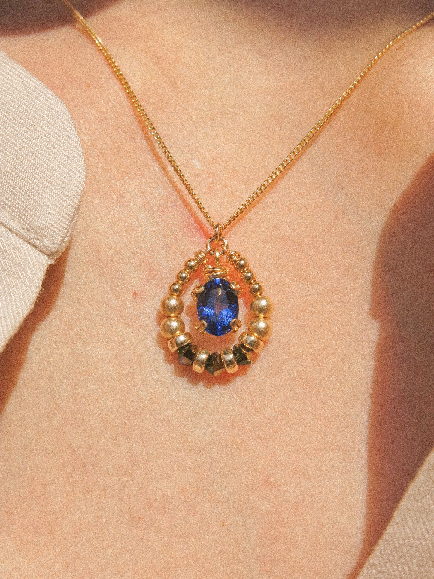 Suila Necklace #2 with Faceted Blue Topaz in Prong Setting with Beaded Frame in Swarovski Crystals, 14K Gold Fill