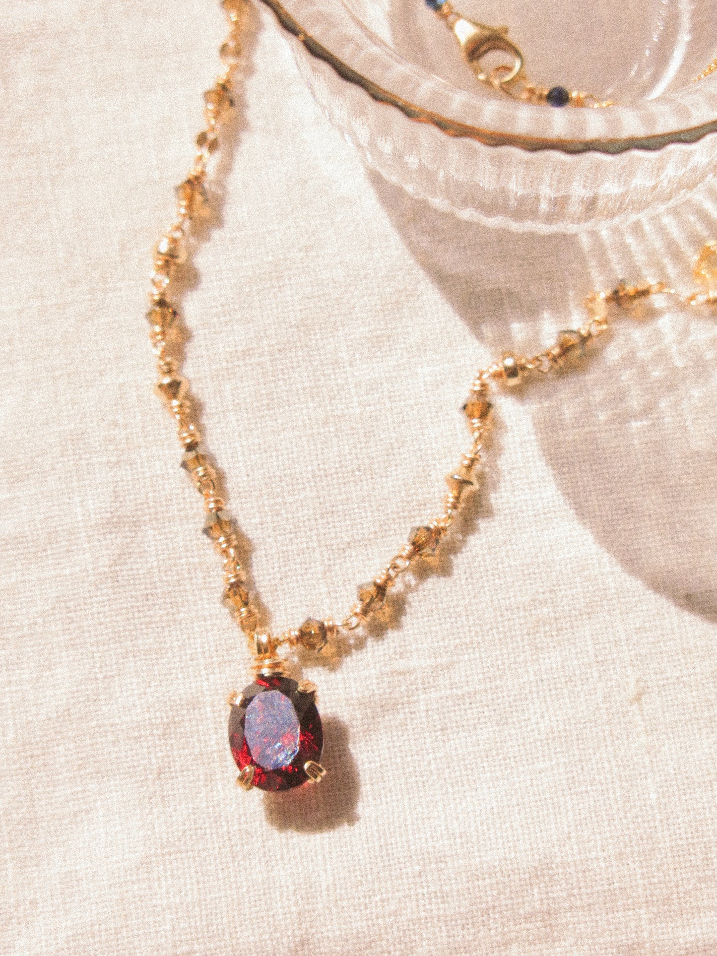 Red: Prong Set Oval Faceted Mozambique Garnet Necklace with Swarovski Crystal Accent Chain, 14K Gold Fill