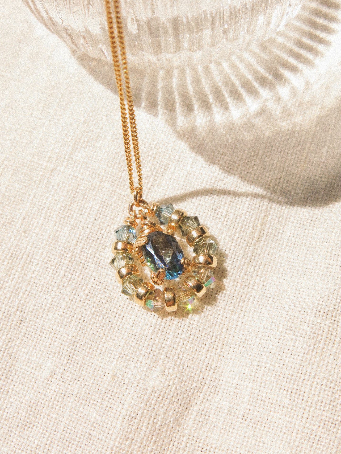 Suila Necklace #1 with Faceted Blue Topaz in Prong Setting with Beaded Frame in Swarovski Crystals, 14K Gold Fill