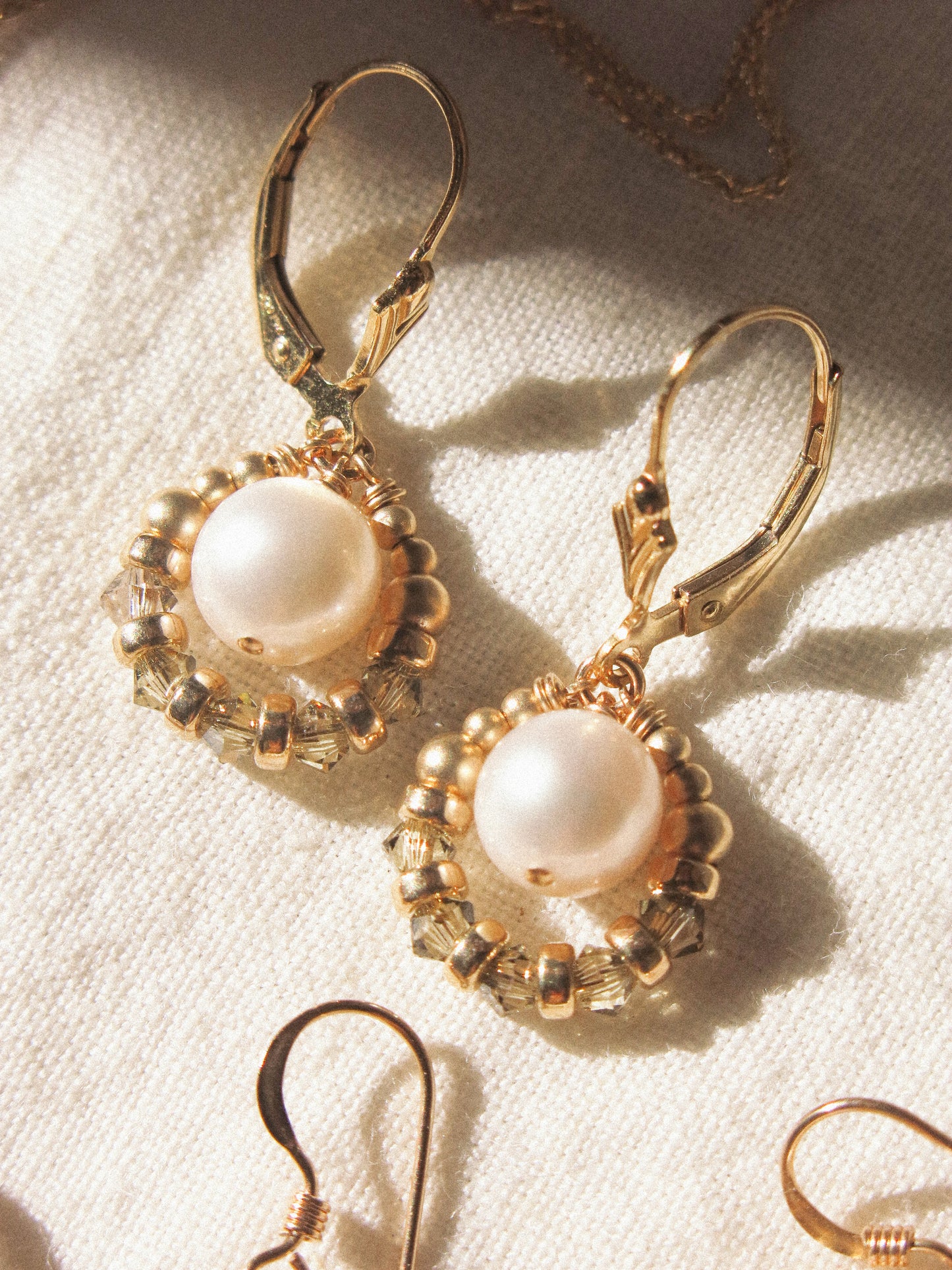 Suila Earrings with White Round Pearl and Muted Silver Green Swarovski Crystal, 14K Gold Fill, Fleur de Lis Lever Back Earrings